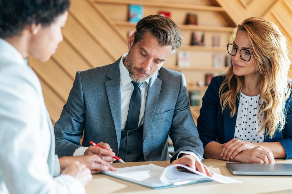 Business people signing a contract